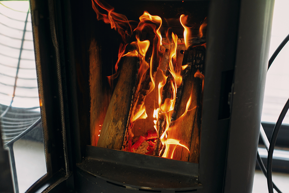 Close up of log burner with door open